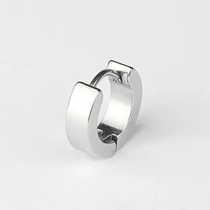 Minimalist silver stainless steel huggie hoop earring featuring a high polish finish