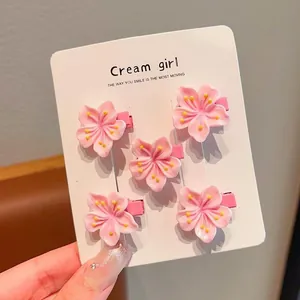 Set of 5 sweet pink cherry blossom flower hair clips on a display card for girls