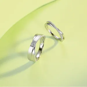 Elegant S925 silver Moissanite couple rings with X-cross design and platinum plating.