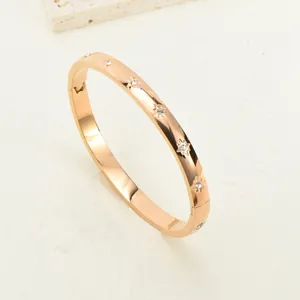 Elegant rose gold titanium steel bangle with star engravings and sparkling rhinestones