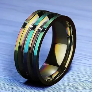 Close-up of rainbow iridescent stainless steel ring for men with grooved texture
