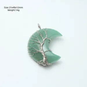 Natural green crystal moon pendant with handmade wire wrapped tree of life design.