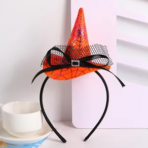 Close-up of the Halloween witch hat headband featuring a vibrant spider web pattern and bow.