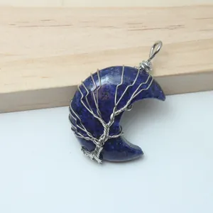 Handmade wire-wrapped tree of life design on a lapis lazuli stone crescent moon pendant