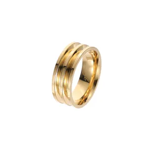 Minimalist gold titanium steel triple-band ring with a polished finish for men.