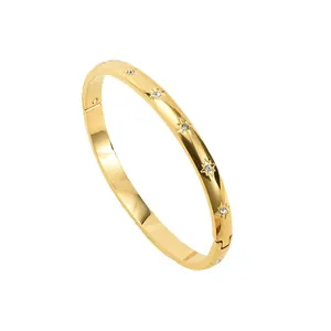 Elegant 18K gold plated stainless steel bangle featuring delicate star-set rhinestones