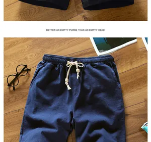 Detailed view of men's navy blue cotton linen shorts featuring an elastic drawstring waistband