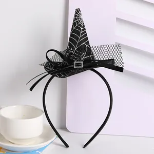 Detailed view of Halloween witch hat headband with spider web pattern and bow