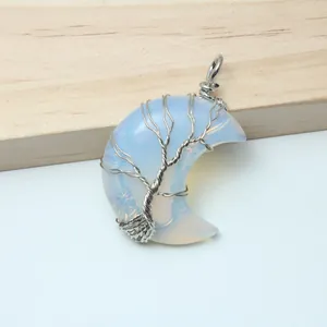Handmade moon shaped pendant with tree of life wire wrapping in opalite crystal stone