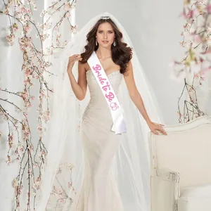 White satin Bride to Be sash with pink glitter lettering for wedding bachelorette parties.