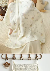 Breathable cotton muslin nursing cover with cute cartoon elephant print for breastfeeding.
