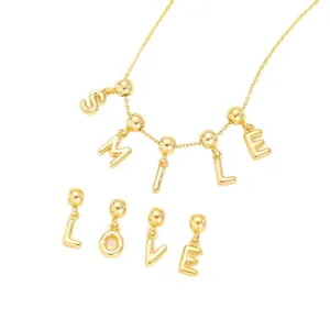 Elegant gold DIY bubble letter necklace set spelling SMILE and LOVE with charms