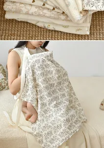 Detailed view of breathable cotton nursing cover with floral print for breastfeeding