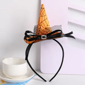 Close-up detail of Halloween witch hat headband featuring orange spider web pattern