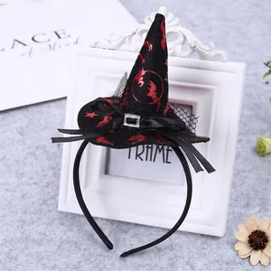 Detail view of Halloween witch hat headband with red foil bat patterns and mesh decorations