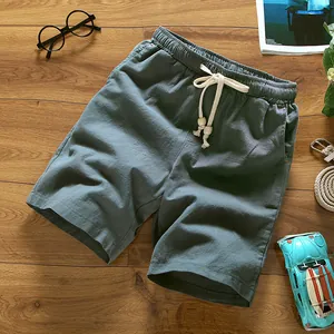 Stylish men's casual cotton linen beach shorts with elastic drawstring waist flat lay