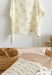 Soft muslin nursing cover with cute rabbit print for discreet outdoor breastfeeding