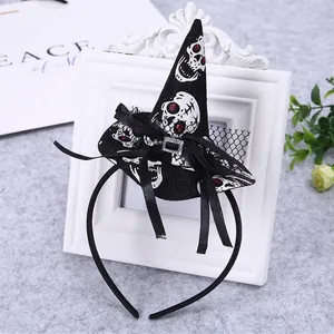 Detailed view of Halloween witch hat headband with skull pattern and black bow