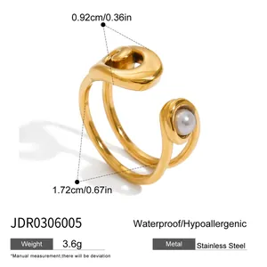 Detailed view of a gold-plated stainless steel paperclip ring with pearl and size specs