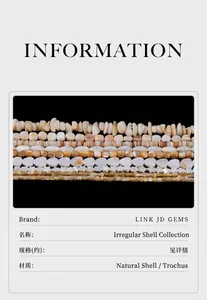 Close-up of various shaped natural shell beads including heart and star patterns