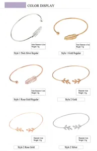 Detailed display of leaf and feather open bangles in gold, silver, and rose gold