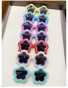 Collection of colorful flower-shaped sunglasses for kids in various bright shades