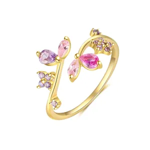 Close-up of gold flower ring with pink and purple zircon stones in leaf shapes