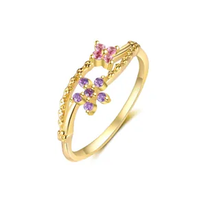 Close-up detail of a gold-plated sterling silver ring with colorful zircon flowers