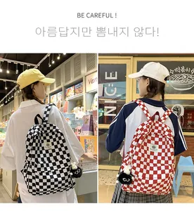 Lifestyle detail of Korean style retro checkerboard backpacks in black and red patterns