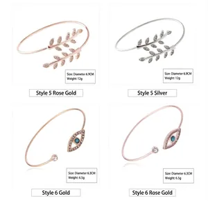 Comparison of leaf and evil eye open bangles in gold, silver, and rose gold finishes.