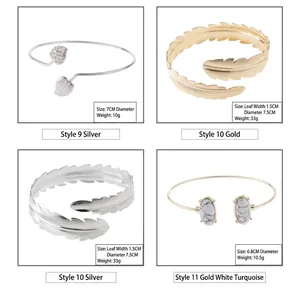 Set of varied alloy open bangles featuring leaf, feather, and turquoise designs.
