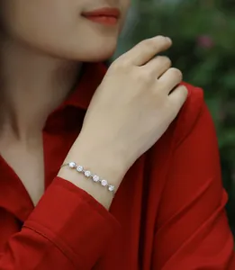 Elegant moissanite silver bracelet worn on a woman's wrist