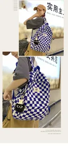 Close-up of blue and white checkered backpack worn by a girl in a casual setting.