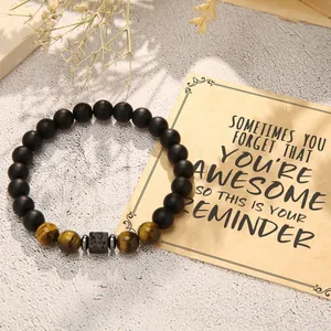 Handmade matte black and tiger eye beaded bracelet with motivational reminder card