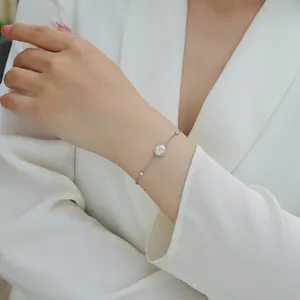 Elegant sterling silver moissanite bracelet on woman's wrist, luxury jewelry detail view