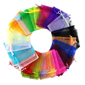 Assorted colorful organza drawstring gift bags arranged in a circle for jewelry packaging