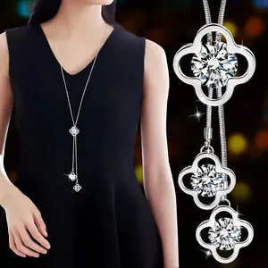 Detail of elegant rotating snowflake pendant on titanium steel long sweater chain