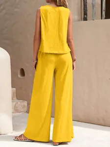 Back view of summer yellow two-piece cotton set with sleeveless top and wide pants