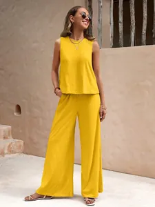 Casual yellow two-piece cotton set with sleeveless top and wide-leg pants