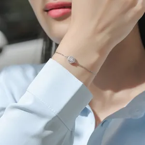 Close-up of a elegant sterling silver moissanite bracelet worn on a woman's wrist