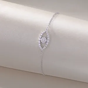 Detailed macro shot of a sterling silver eye-shaped bracelet set with sparkling moissanite stones