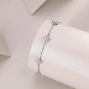Detailed view of sterling silver moissanite bracelet with elegant four-leaf clover motif