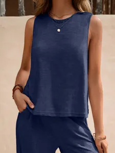 Detail view of a navy blue sleeveless cotton top and matching pants set for women