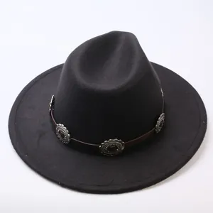Detail of black felt fedora hat featuring a brown leather band with silver buckles.