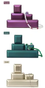 Selection of premium jewelry boxes for rings and necklaces in purple, teal, and gold
