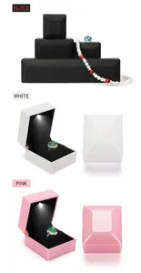 Detail view showing premium LED light jewelry boxes in black, white, and pink finishes