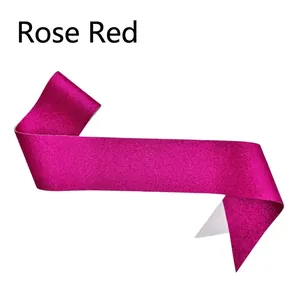 Close-up of rose red glitter ribbon sash for parties and ceremonies