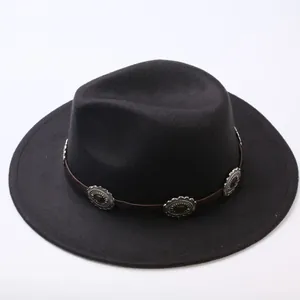 Detail view of a classic black felt fedora hat with a decorative studded leather band.