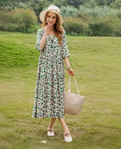 Elegant green floral cotton silk midi dress with half sleeves for summer beach wear.