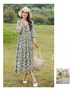Elegant green floral cotton silk midi dress with half sleeves for summer beach wear.